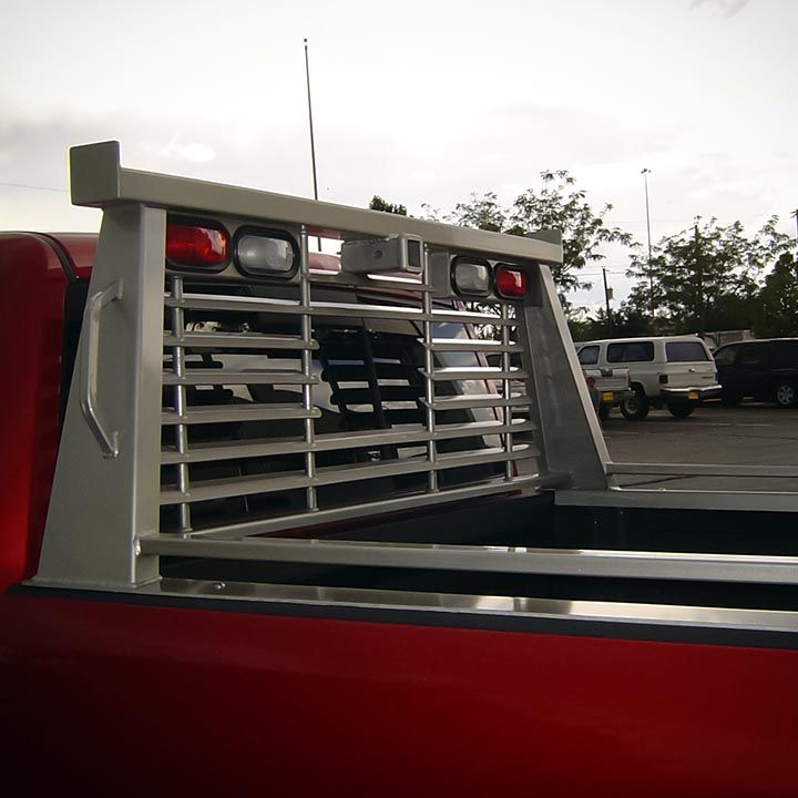 A Red Truck With a Grille on the Back of it - Truck Unique