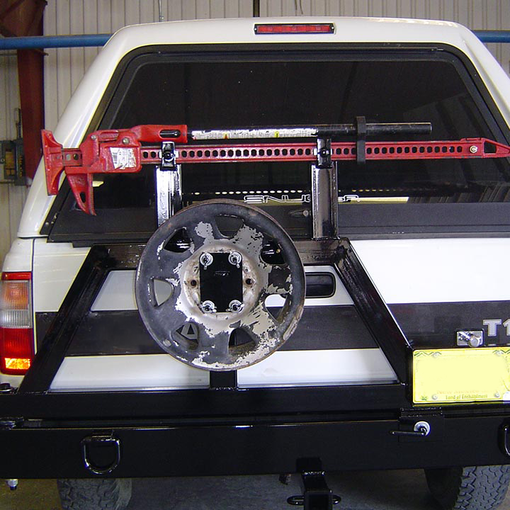 A Toyota Truck With a Spare Tire Attached to the Back - Truck Unique