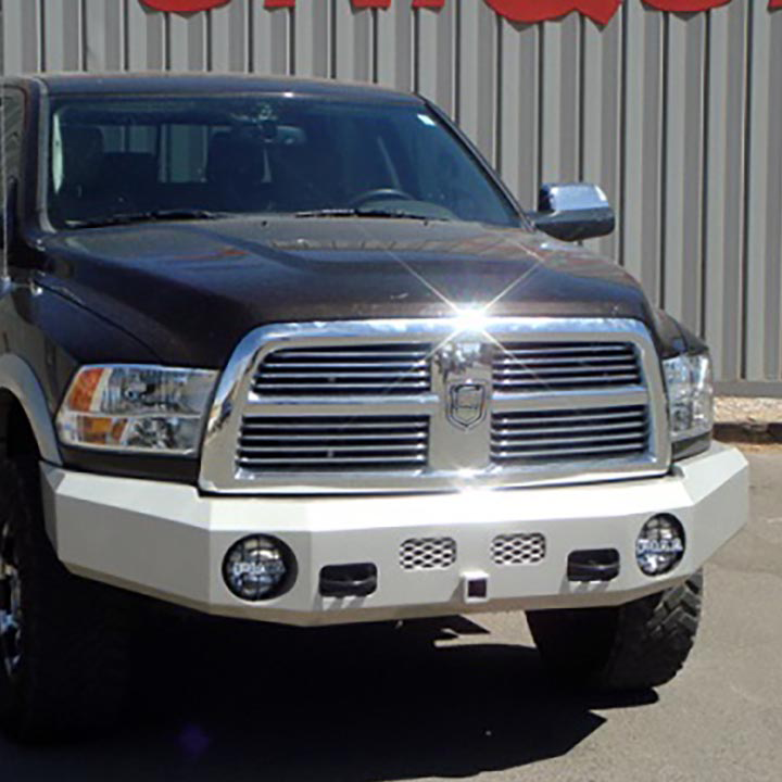A Black Dodge Ram Truck is Parked in front of a Building - Truck Unique