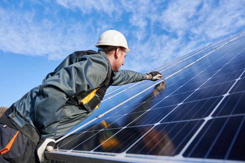 Man On A Uniform Repairing The Solar Panel - Aledo, Texas - Parker County Solar