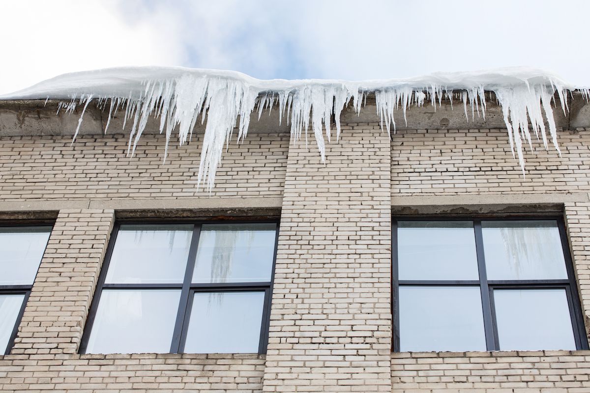 Don’t Let Ice Ruin Your Commercial Roof in Columbia, MO. Call Chavez Enterprises’ Roofing Experts.