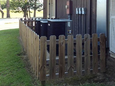 wood fence around HVAC equipment