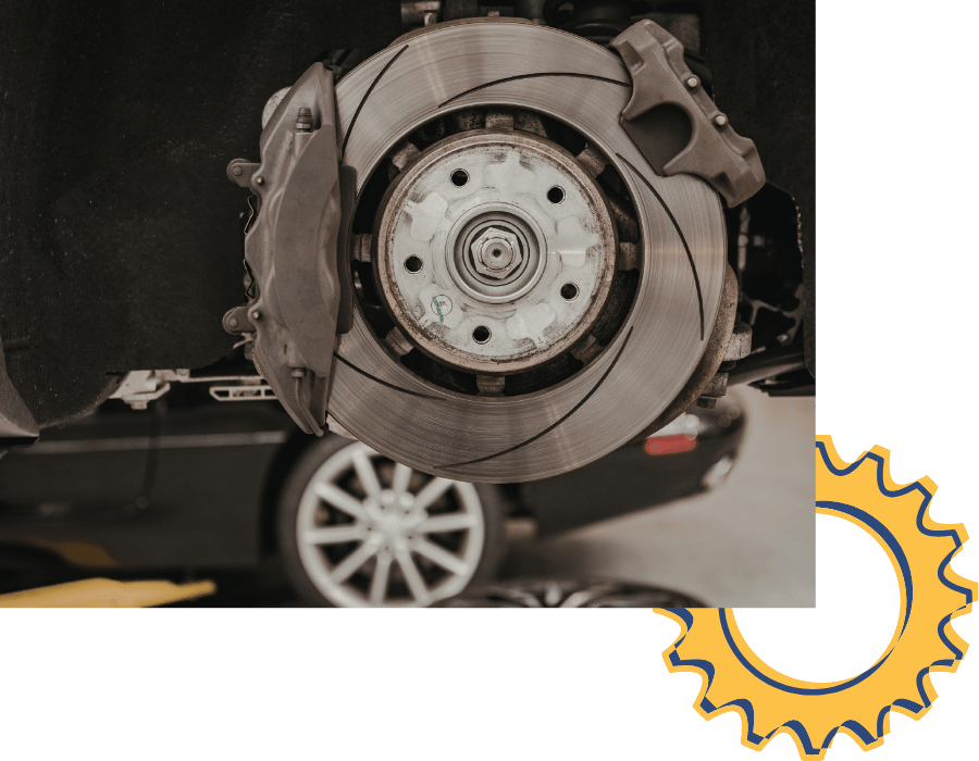 Close-up of brake rotor and caliper assembly during brake repair service.