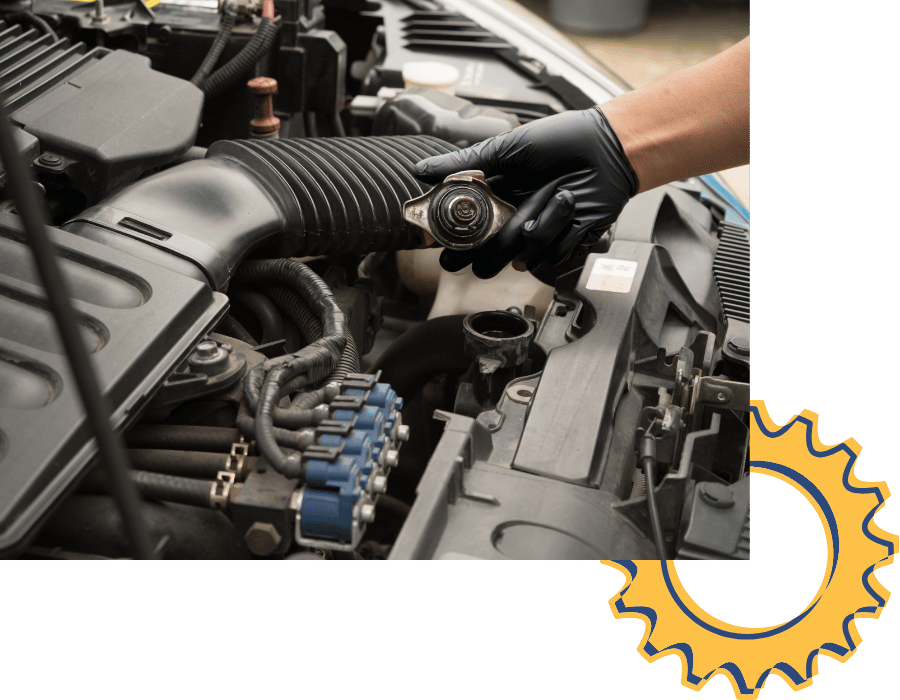 Technician holding radiator cap during cooling system inspection and repair.