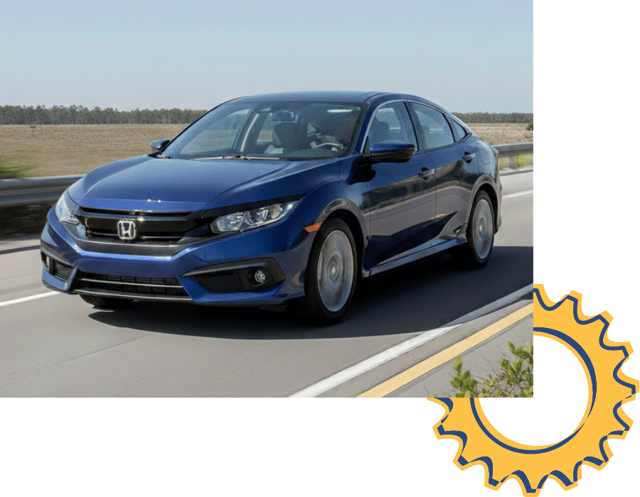 Honda Civic sedan driving on highway.