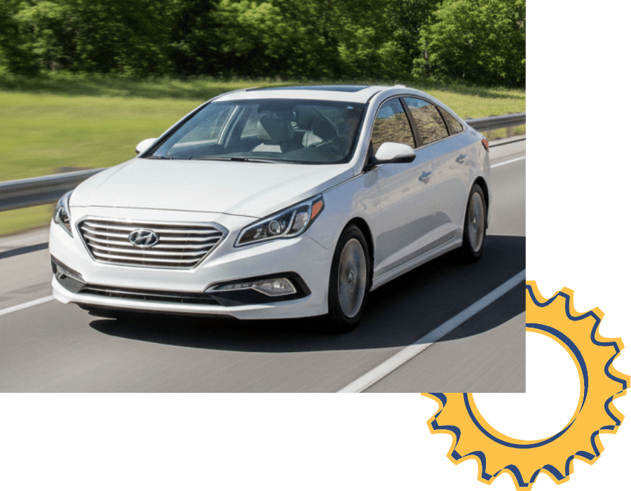 Hyundai Sonata sedan driving on open road.