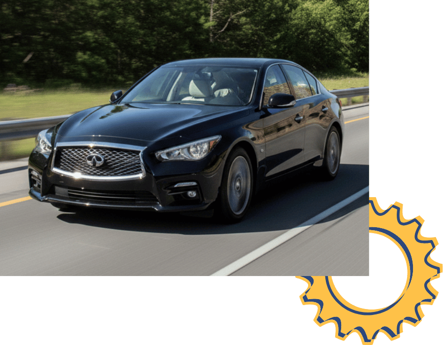 Infiniti Q50 sedan driving on highway.