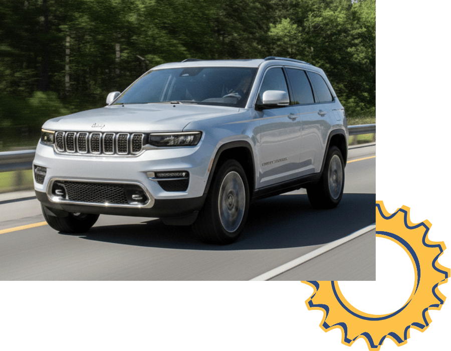 Jeep Grand Cherokee SUV driving on open road.