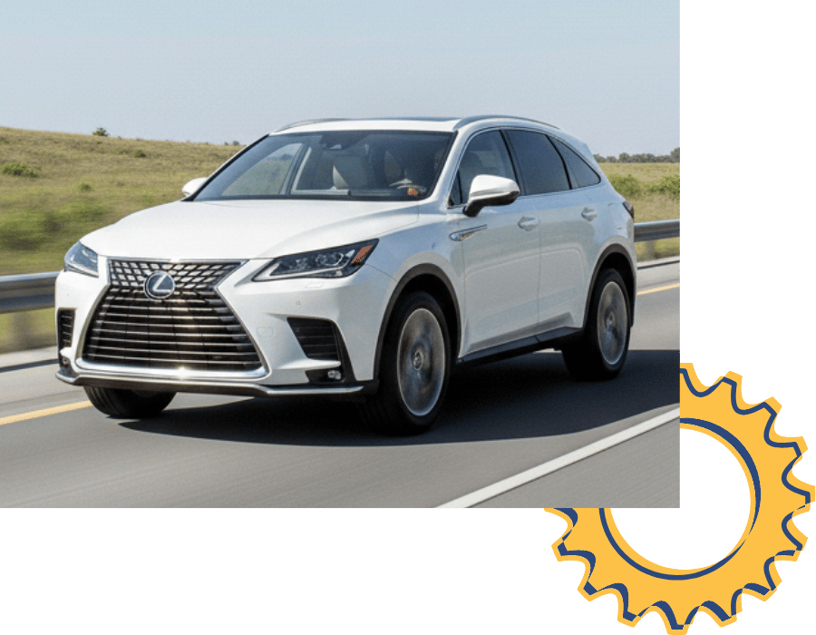 Lexus RX SUV driving on open road.