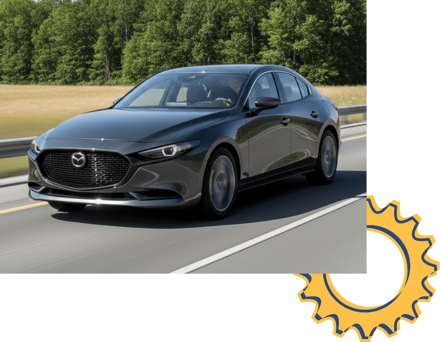 Mazda3 sedan driving on highway.