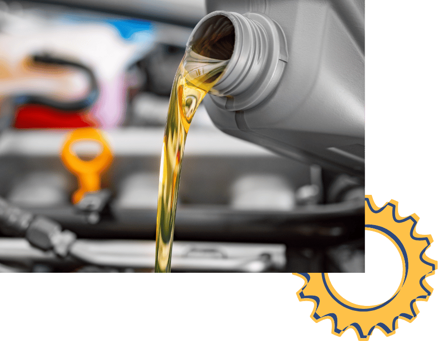 Motor oil being poured into engine during oil change service.