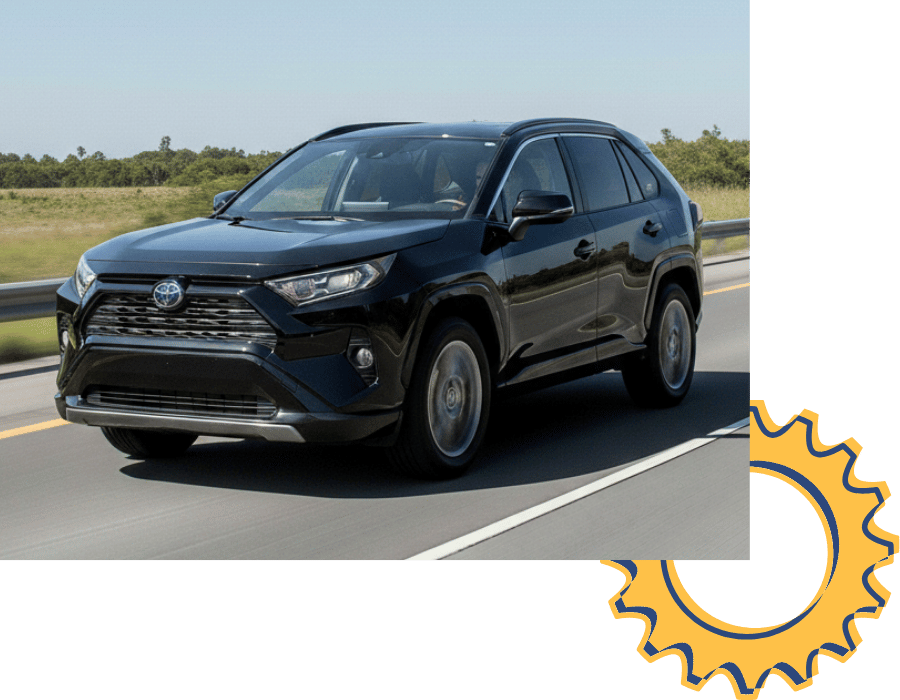 Toyota RAV4 SUV driving on open road.