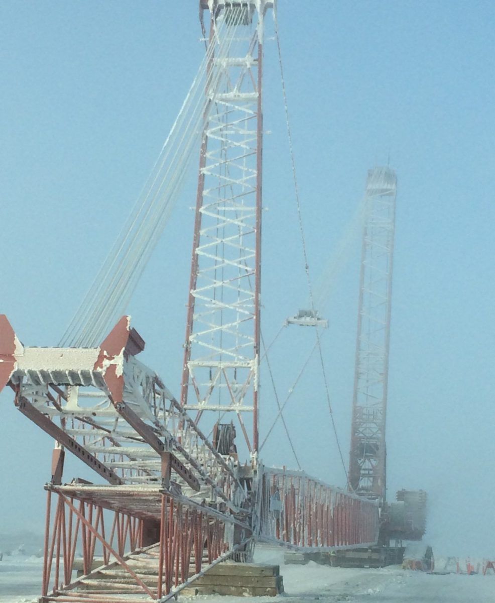 A very tall tower with the letter x on it