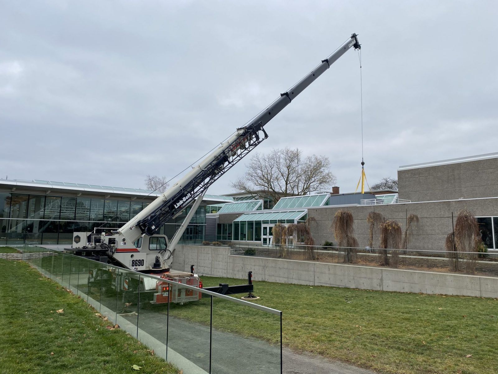 large crane in front of a building.
