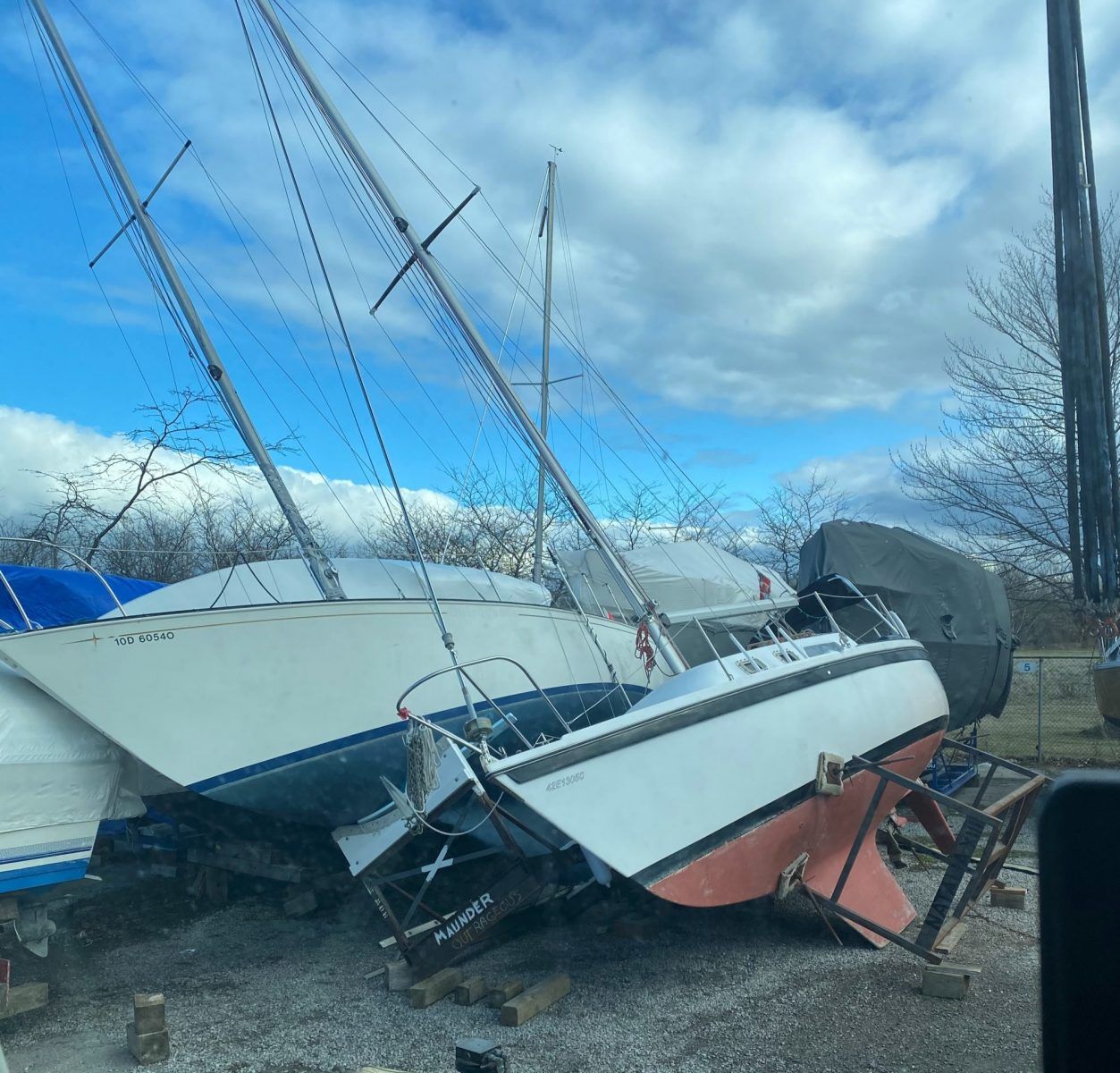 A row of boats sitting on the ground