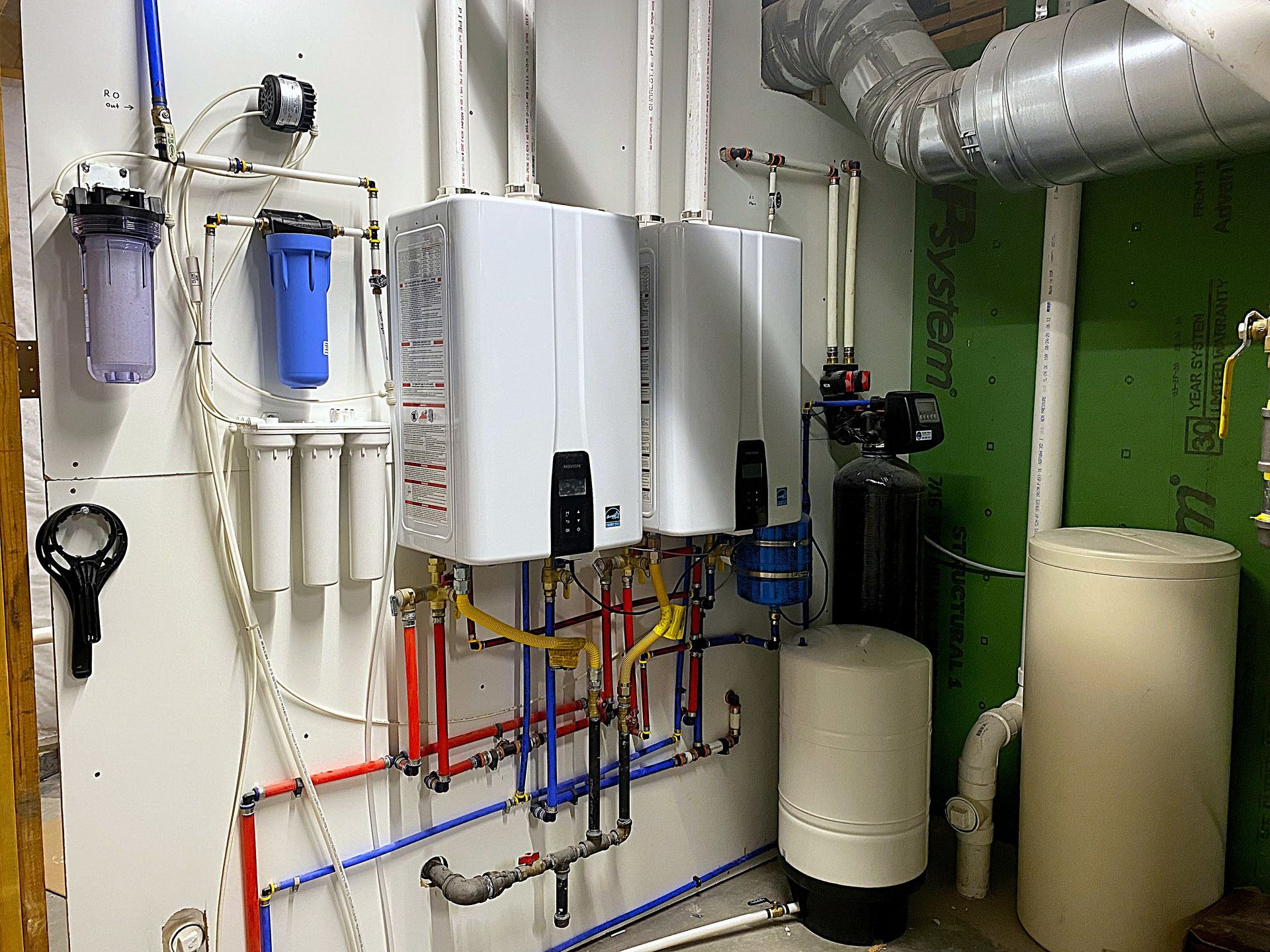 Sharp Water Solutions tankless water heaters in Sandy UT basement for Utah's hard water to extend lifespan up to 30%.