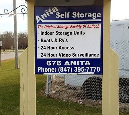 Sign for Anita Self Storage in Antioch, IL, offering indoor units, boat & RV storage, and 24-hour access/surveillance.