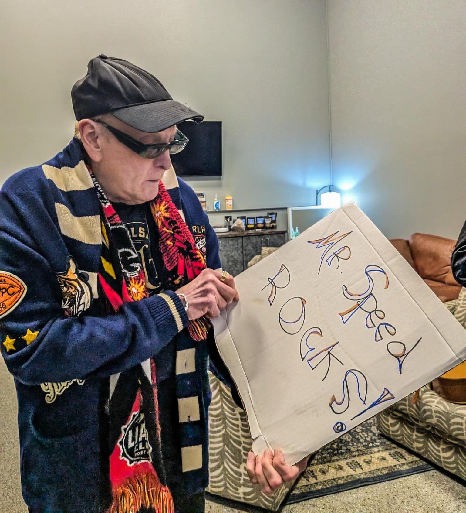 Rick Nielsen of Cheap Trick with Mr. Speed Rocks! sign