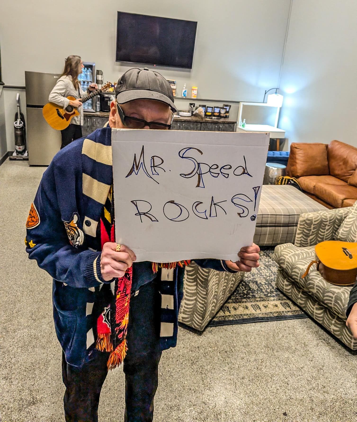 Rick Nielsen of Cheap Trick with Mr. Speed Rocks! sign