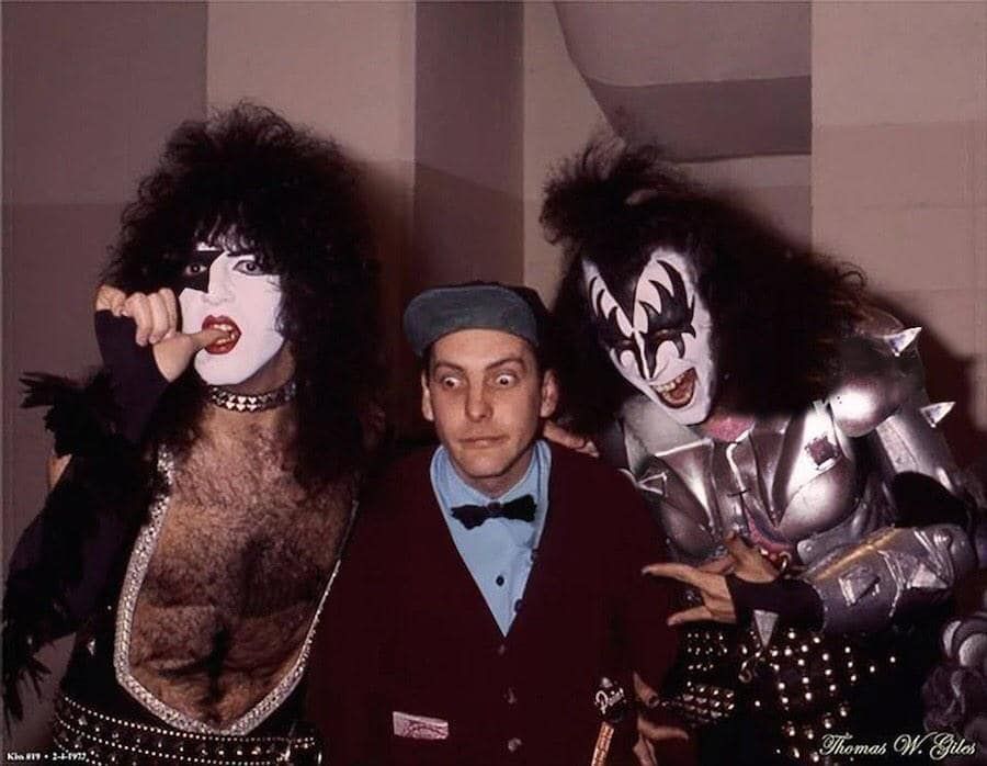 Paul Stanley, Rick Nielsen, Gene Simmons posing backstage
