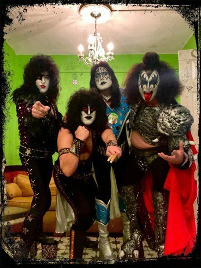 a poster for a community concert with kiss on it .