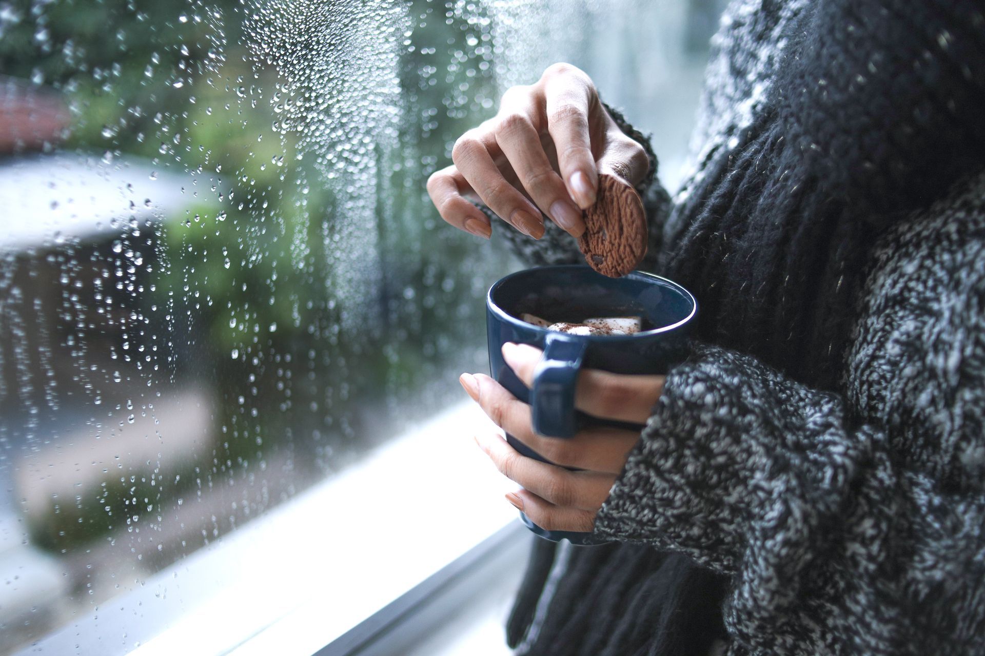 Holding cup of hot chocolate on a cold day