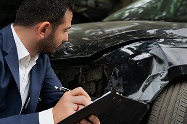 Auto Insurance — Checking Car Dent in Toledo, OH