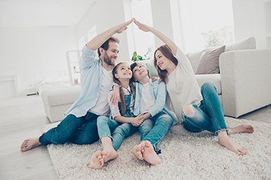 Homeowners Insurance — Happy Family Inside House in Toledo, OH