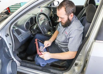 Mechanic Performing Interior Vehicle Diagnostics | Andy's Auto Repair & Tires Inc.