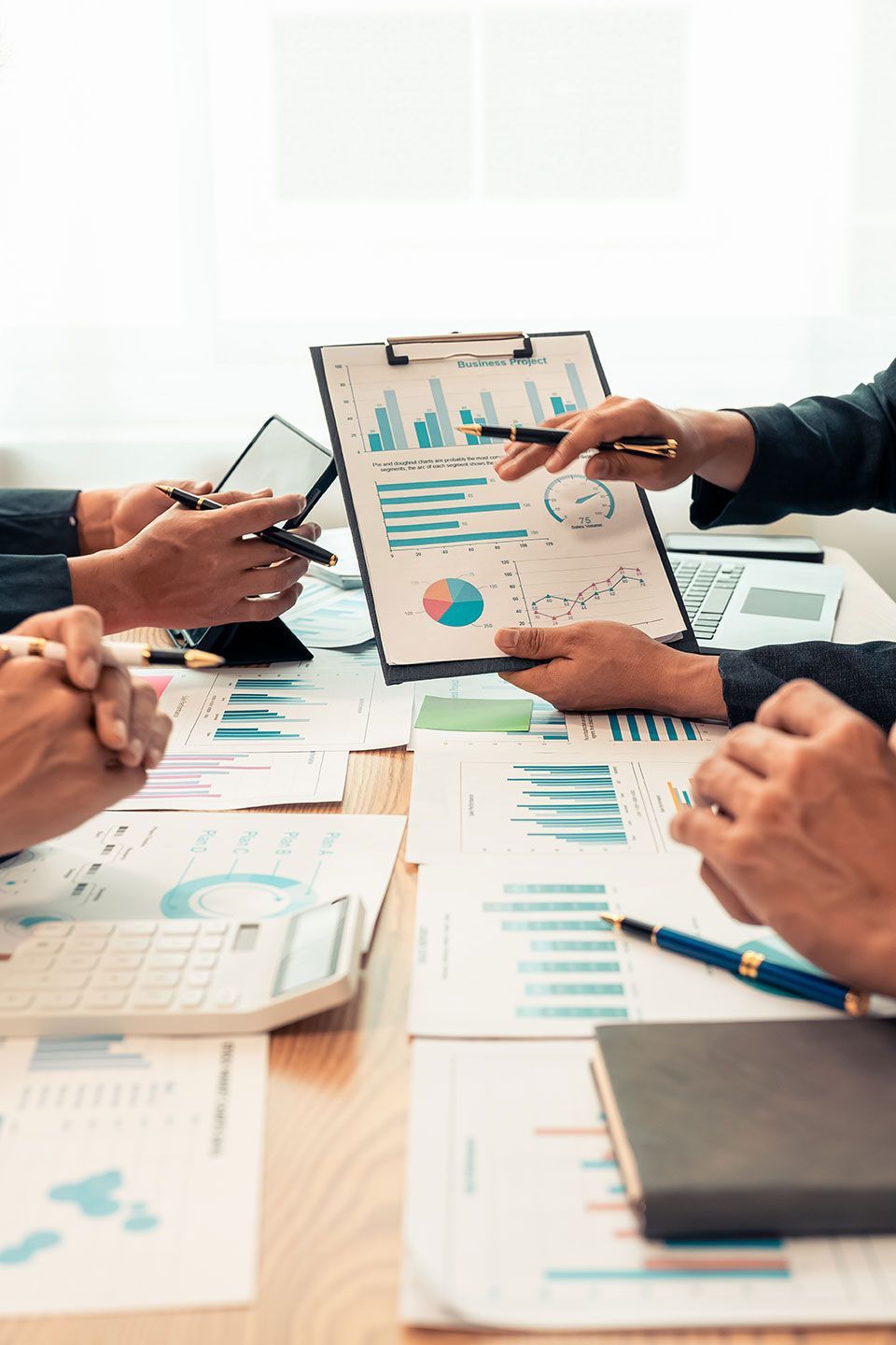 Planning data, annual reports, research and budgets in the office Company discussion with documents in strategy meeting Chart analysis vertical close-up image