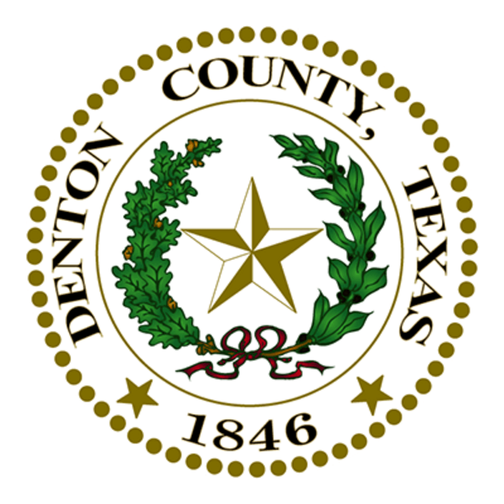 Denton County, Texas seal: gold star, wreath, and "Denton County, Texas 1846" in gold on a white background.