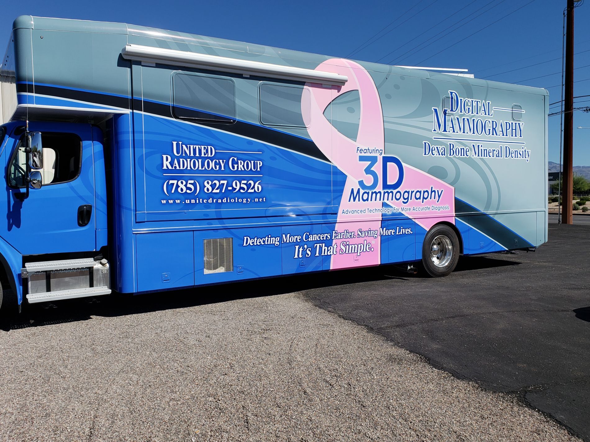 Mobile medical unit that was just wrapped in blue and grey with pink breast cancer logo