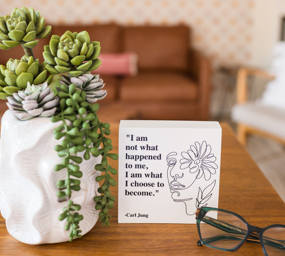 Succulents in a white vase, quote 