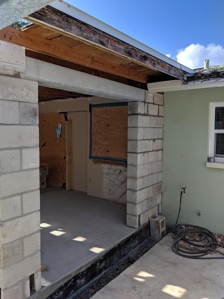 A house is being built with bricks and a window