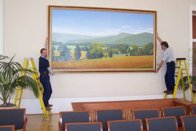 Men Carrying Large Painting — Alexandria, VA — Buchanan and Kiguel Fine Custom Picture Framing