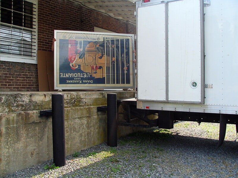 Taking Out Painting from Vehicle — Alexandria, VA — Buchanan and Kiguel Fine Custom Picture Framing