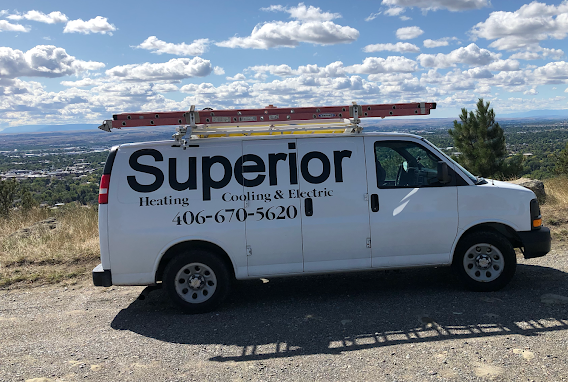 A white van with the word superior on it is parked on the side of the road.