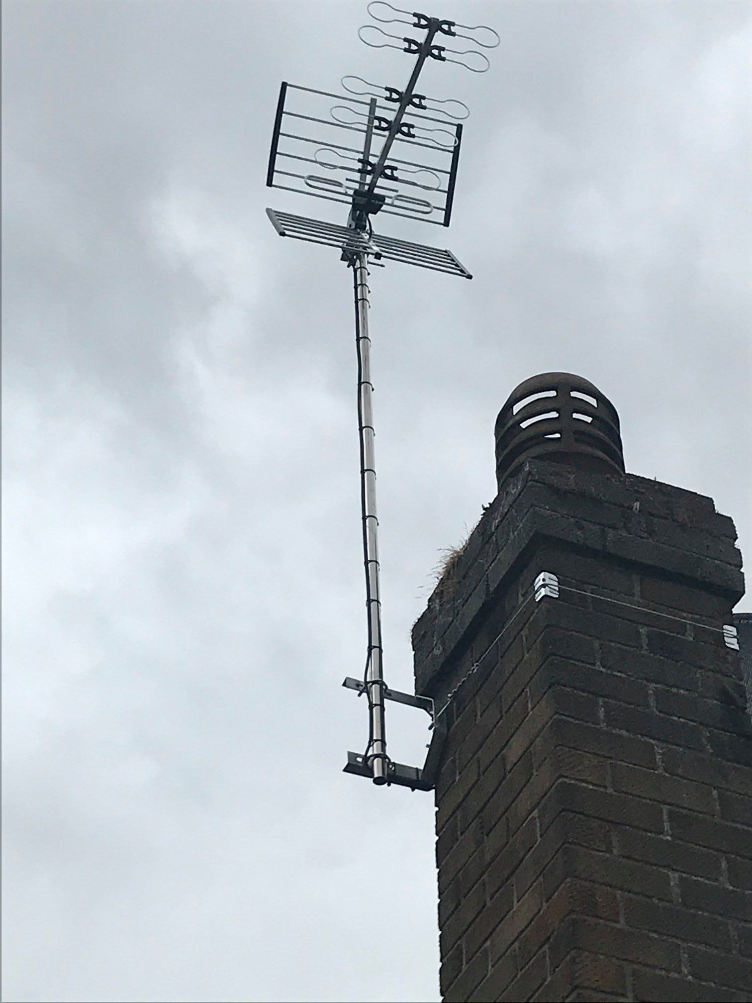 TV aerial fixed to a chimney.