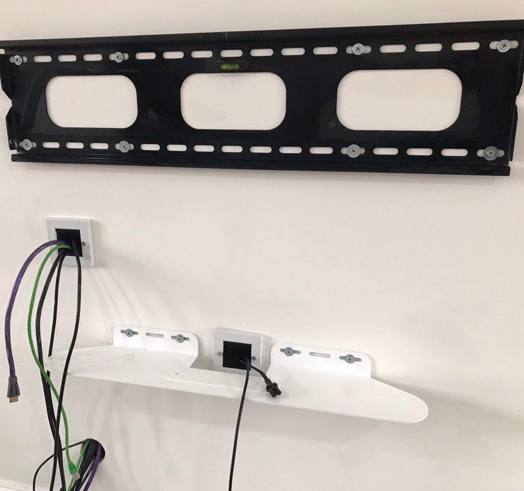 TV wall mount fixed to wall ready for a TV to be attached.