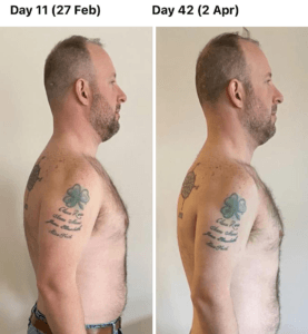 A man without a shirt has a tattoo on his arm