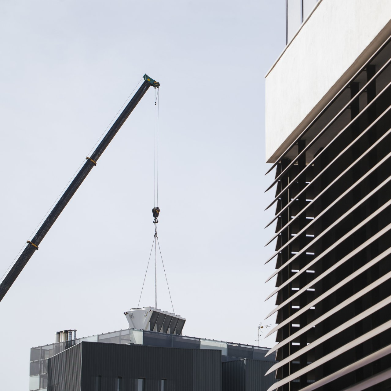 Crane Holding an Air Conditioner