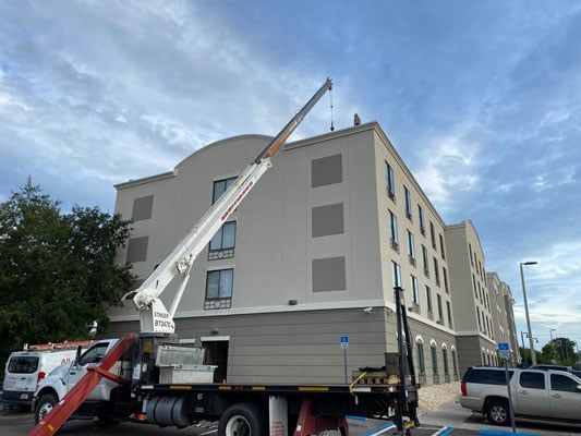 Crane Truck Outside a Buidling
