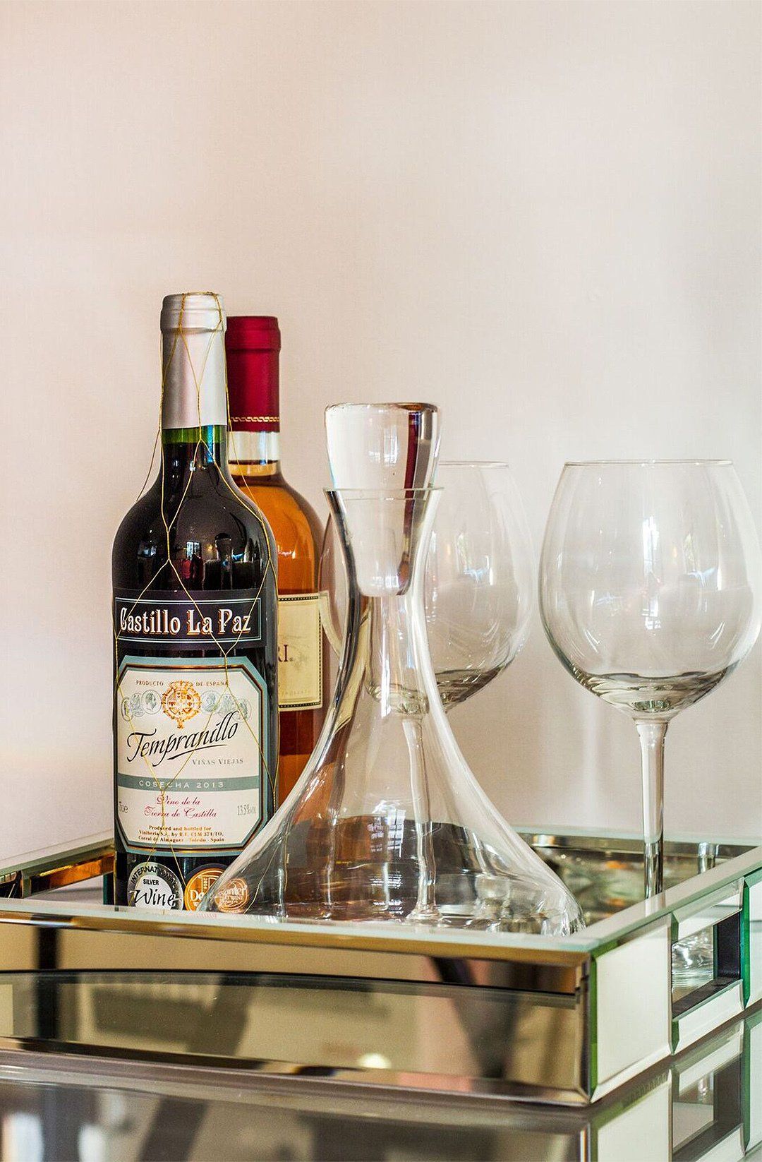 Wine bottles, carafe and glasses interior design