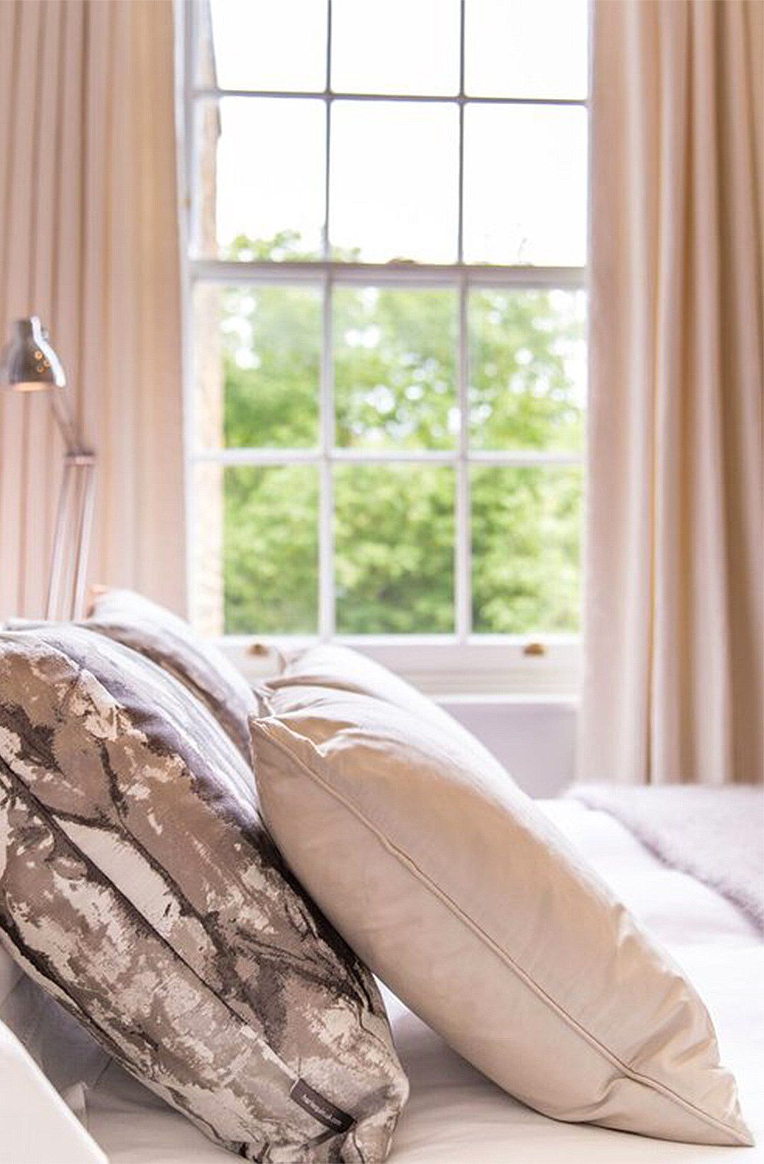 Pillows on bed closeup interior design