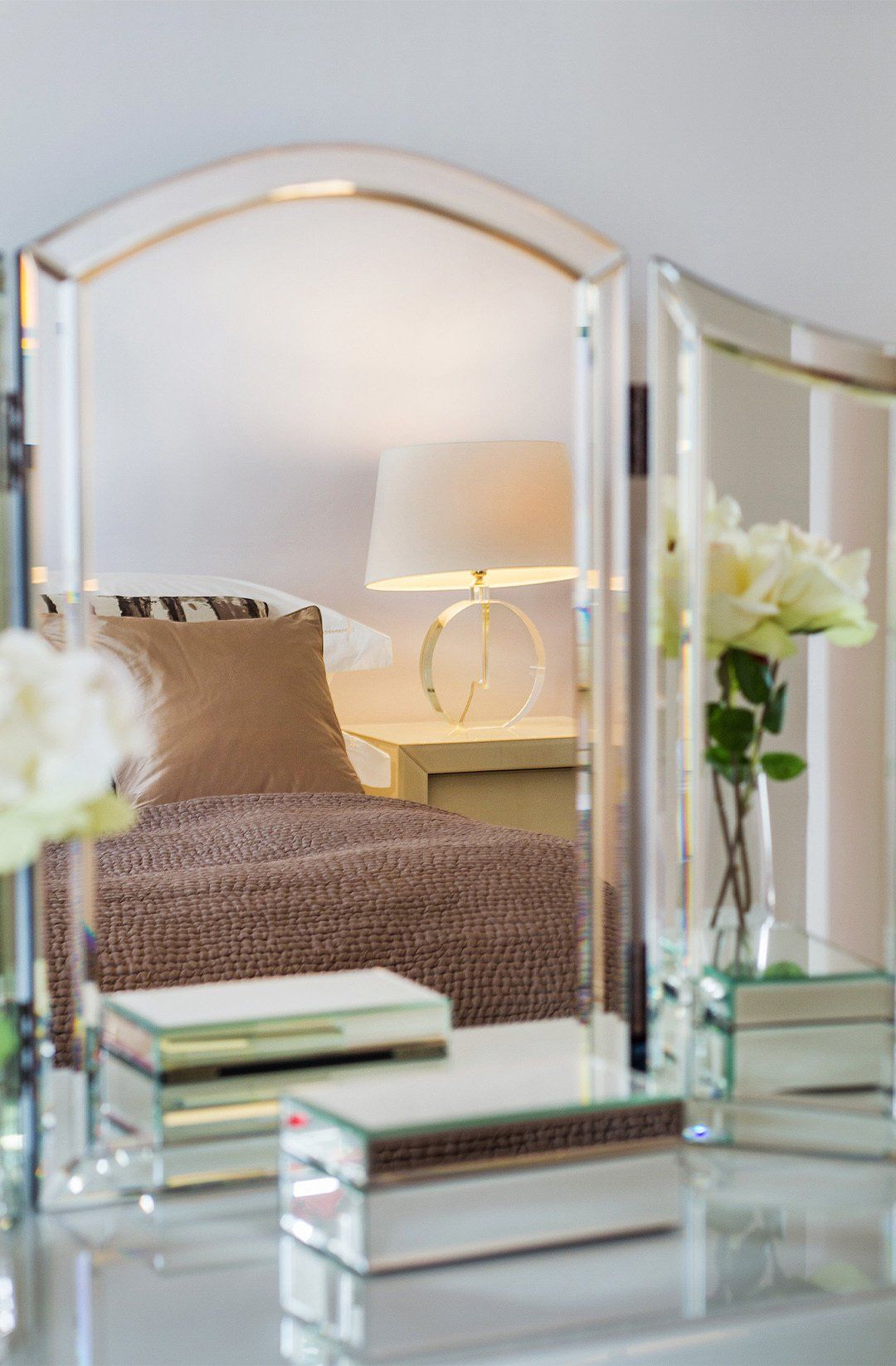 Mirror closeup with bed reflection interior design