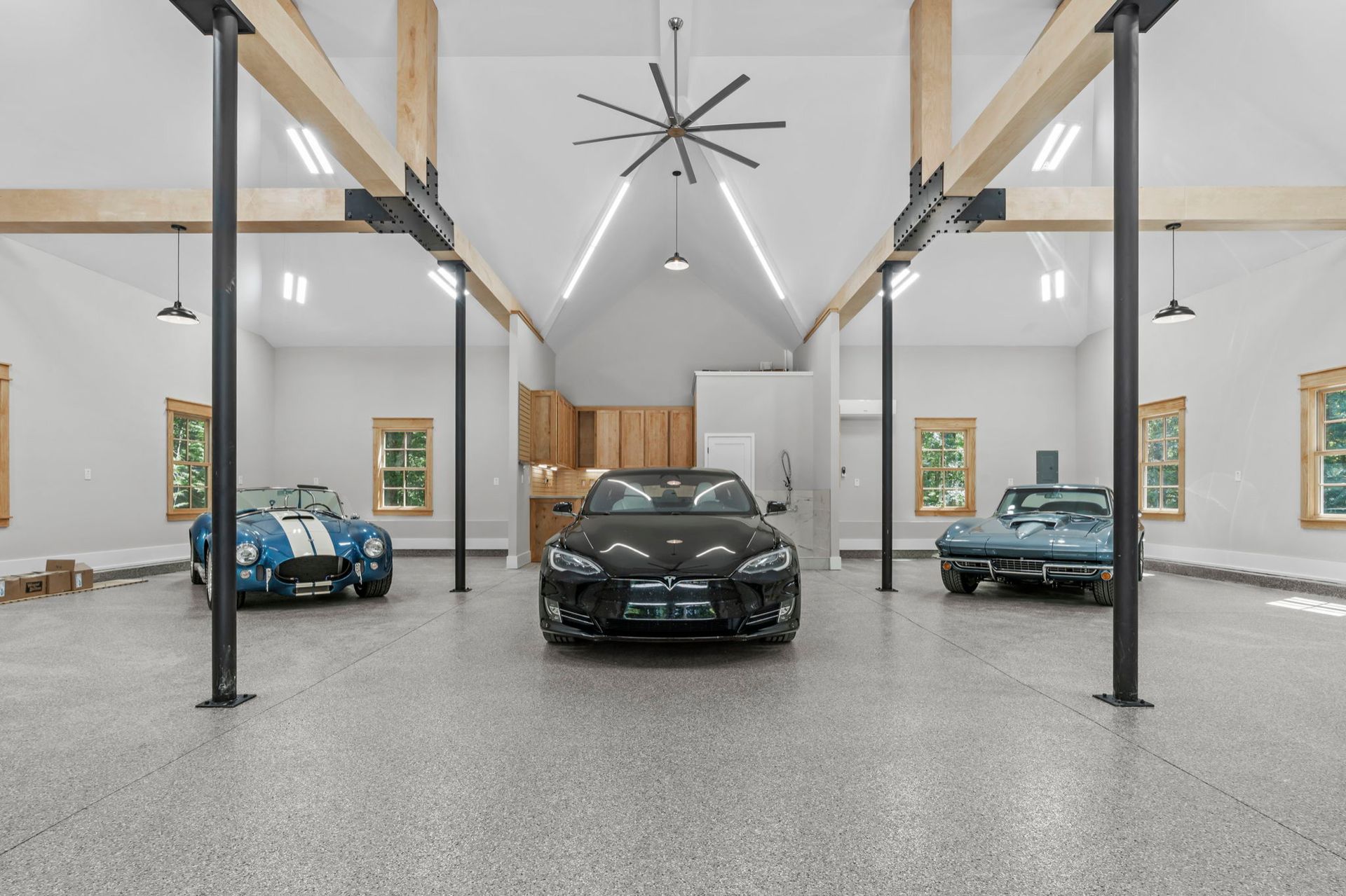 A living room with a table, television, and sliding glass doors.