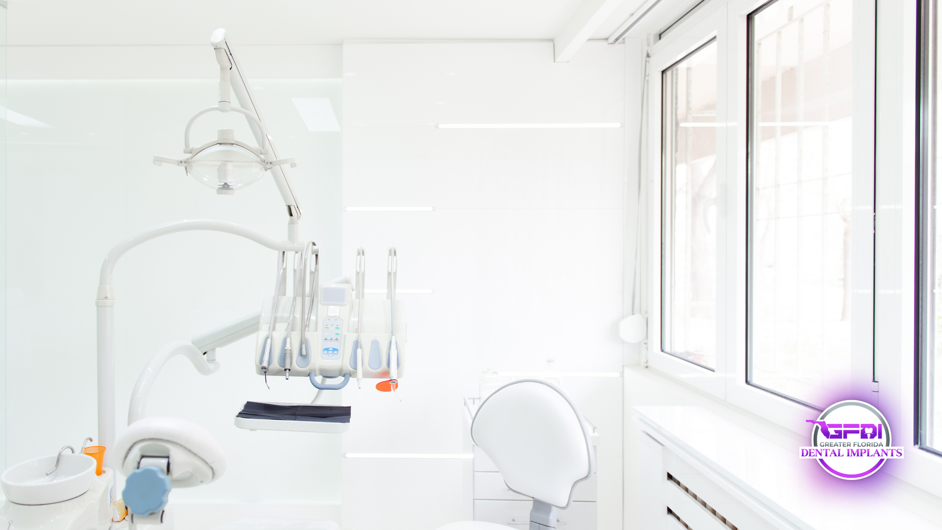 Dental office interior with dental tools, a chair, and a bright window.