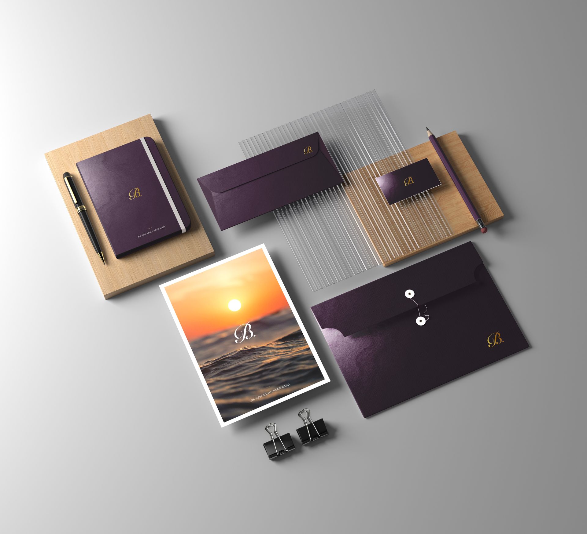 a mockup of a company 's corporate identity with a sunset in the background