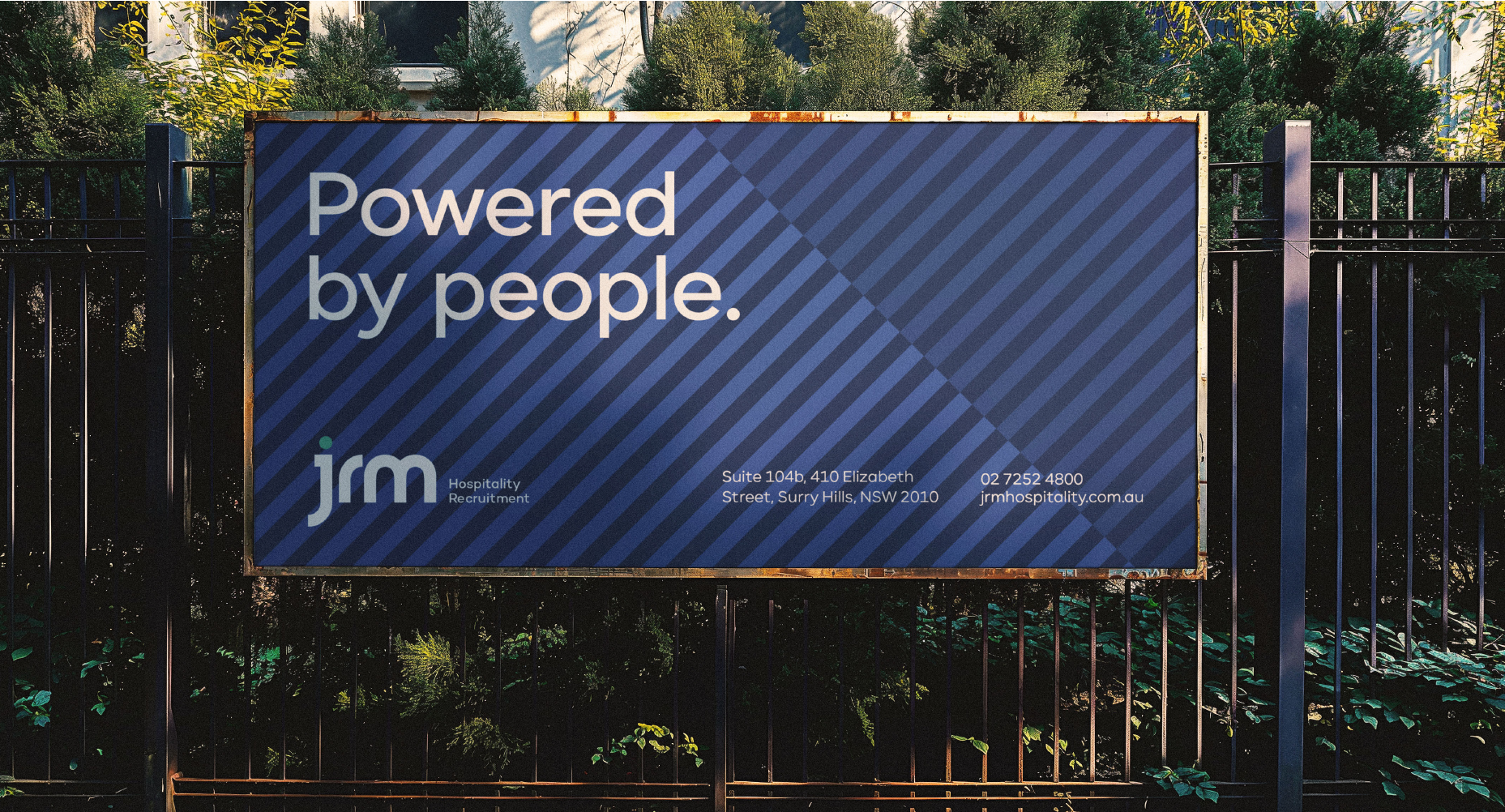 a man is running on a blue and purple billboard .