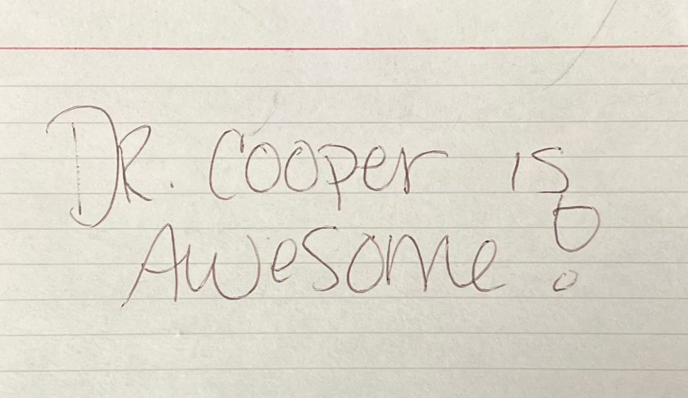 A piece of paper that says dr. cooper is awesome